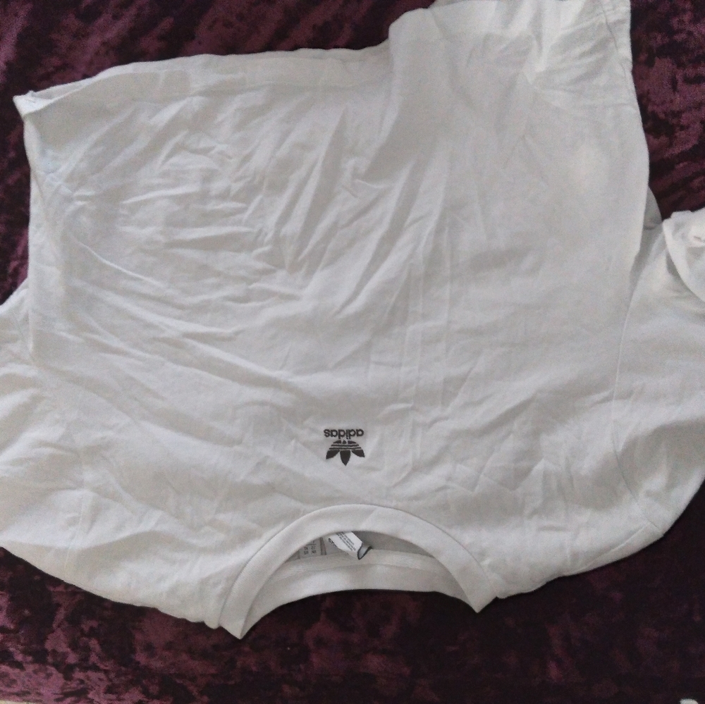 White Adidas crop top.
